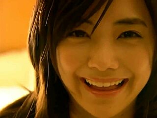 cute japanese girl in a sexy bikini shows off big tits