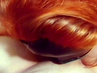 Amateur redhead wife slurps cock, getting creampie with big natural tits.