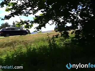 hot brunette reveals her nylon feet in a candid street moment