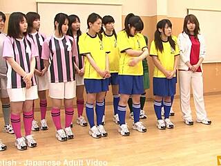 Japanese female team listens closely to their coach’s intense lesson.