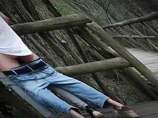 Fucking a brunette with big tits in a natural park, risking getting caught.