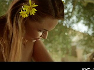 two hot lesbians, a blonde and brunette, play with toys in the wild garden