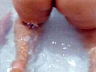Teen wife shows her ass in a motel bathtub