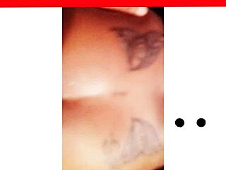 i'm npleasures showing off my new ass tattoo