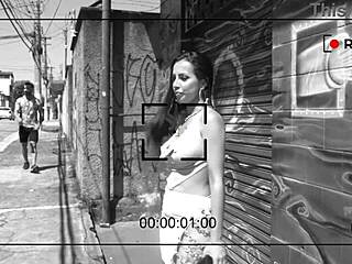 This is a behind the scenes look at a porn shoot with a brunette adult film star