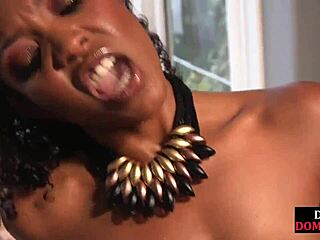 Black femdom straps on to peg sub before riding his cock