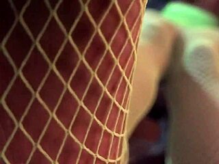 ebony amateur worships green fishnets in interracial domination scene