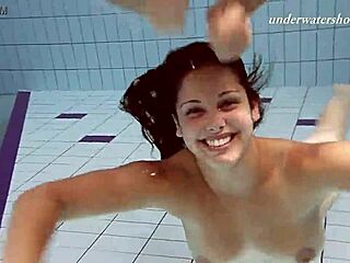 iva brizgina and paulinka share steamy softcore moments as lesbians in the pool