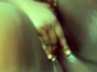 Ebony babe squints during intense solo play!