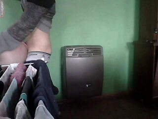 Latina milf couple fucks passionately in the kitchen by the heater