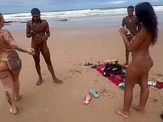 Yo, banging this hot chick on the beach while everyone watches, unreal