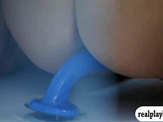 Two glamour babes fucking a blue dildo... oops, i mean playing with it