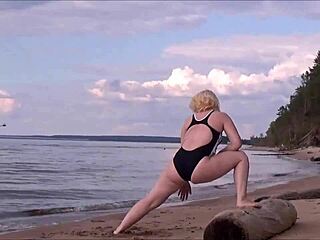 Blonde amateur in costume gets wet and wild at sea bath