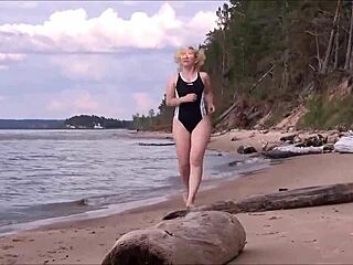 Blonde amateur in costume gets wet and wild at sea bath