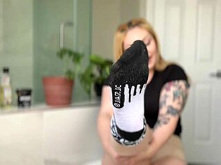 Blonde babe oiled up shows off her fetish feet in detail