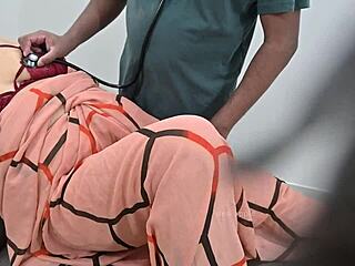 indian doctor examines a lady patient closely in the clinic setting. a routine check turns detailed.