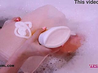 This super cute teen enjoys a steamy bath. Watch her sensual moves!