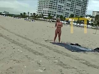 brandi bae jerks off a stranger with sloppy handjob on a crowded public beach.