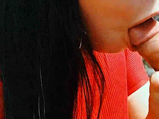 A couple risks a passionate blowjob in the open nature outdoors