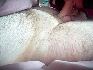 redhead in red lingerie teases with a blowjob