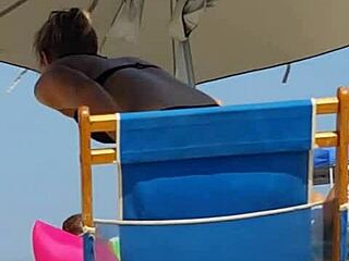 candid shot of 18+ slut in bikini at beach