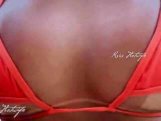 This married brunette is showing off her huge ass in the rooftop pool