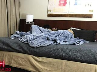 What are the couple doing in the hotel room?