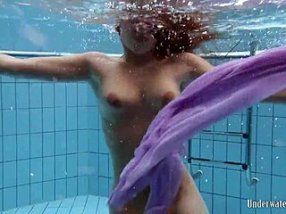i can’t stop staring at aneta’s big tits in that purple dress underwater in the pool. her petite 18+ body just drives me wild.