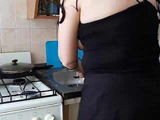 while my stepmom is cooking dinner in the kitchen, my girlfriend licks my pussy to orgasm in homemade lesbian action.