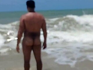 Filming alpha male pounding and cumming on beach
