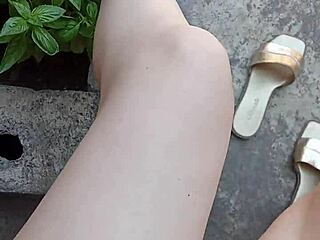 Gretala boldly airs her pussy in the courtyard.