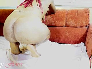 she spreads her thick legs revealing her hairy black pussy for masturbation