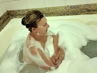 Fucking a 58-year-old woman forcefully in the foamy jacuzzi