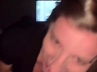 In a quiet room, a woman eagerly sucks a massive black cock, her interracial encounter building to climax.