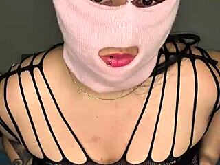 Masked babe with big tits pounds her pussy intensely