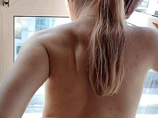 Hairy teen fucks riskily by the window.