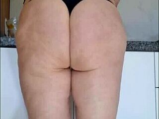 Hidden camera catches stepmother in kitchen in just panties and see-through blouse