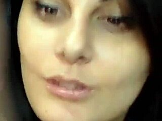 Brunette Rests on Bed During Webcam Session