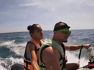 Asian girlfriend gives a blowjob in public on a jetski