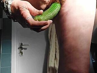 German granny intensely fucks pussy with cucumber