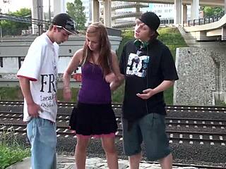 hey, cum blasts Alexis Crystal's pretty face during public railroad threesome blowjob