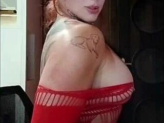 Tanned redhead fitness babe shows big tits and ass