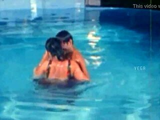 Unmarried hot couple enjoying at the swim pool