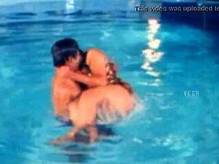 Unmarried hot couple enjoying at the swim pool