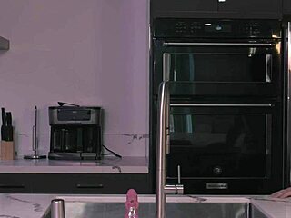 sara jay, the milf, plays with her dildo in the kitchen.