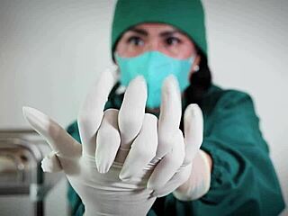 In the hospital, a nurse with latex gloves checks a patient, exploring her fetish.