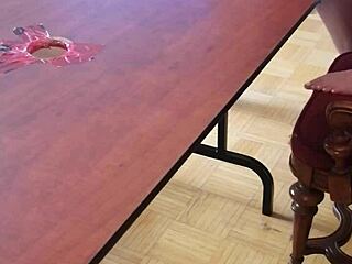 she stomps cum out of his huge cock on the desk