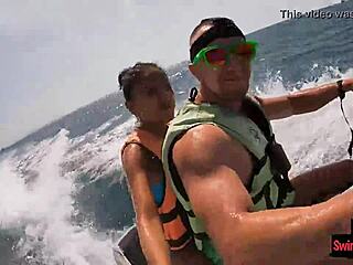 Asian girlfriend gives a blowjob in public on a jetski