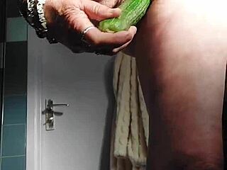 German granny intensely fucks pussy with cucumber
