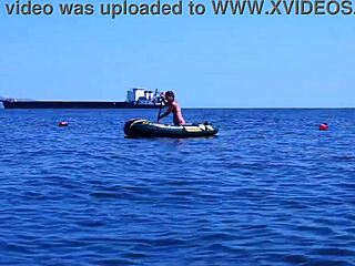 mature babe lounges in bikini on volga river boat ride